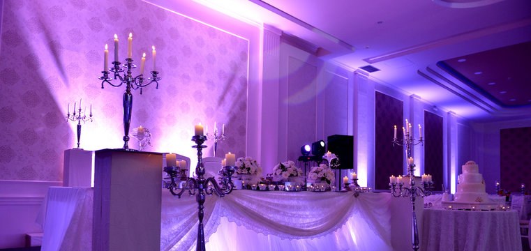 Purple uplighting at an elegant wedding venue